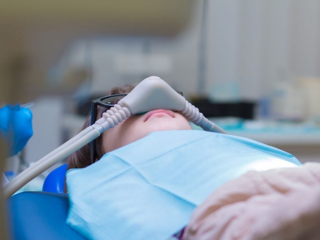 Dentistry.,Little,Girl,Getting,Inhalation,Sedation,While,Teeth,Treatment,At