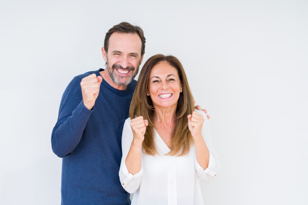 Beautiful,Middle,Age,Couple,In,Love,Over,Isolated,Background,Excited