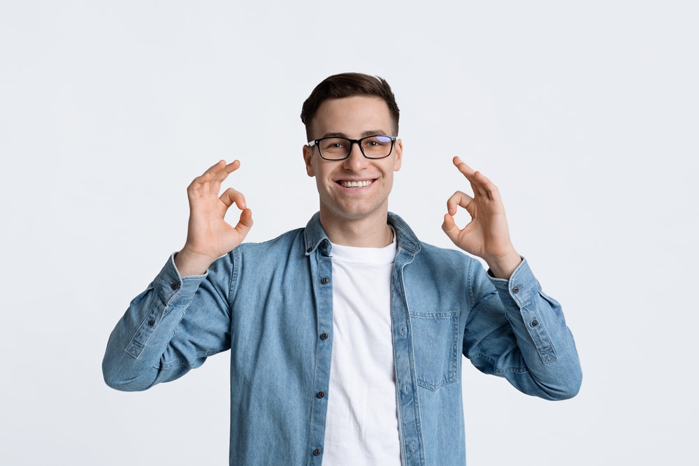 Everything,Is,Great,Concept.,Guy,In,Glasses,Showing,Ok,Sign
