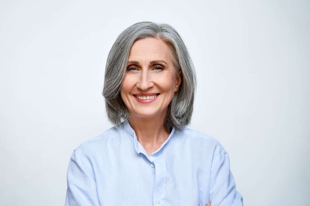 Smiling,Beautiful,Mature,Business,Woman,Standing,Isolated,On,White,Background.