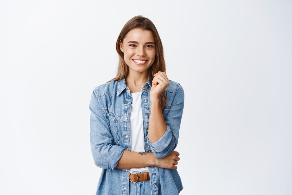 Happy,Successful,Woman,Standing,In,Casual,Outfit,,Smiling,Pleased,At