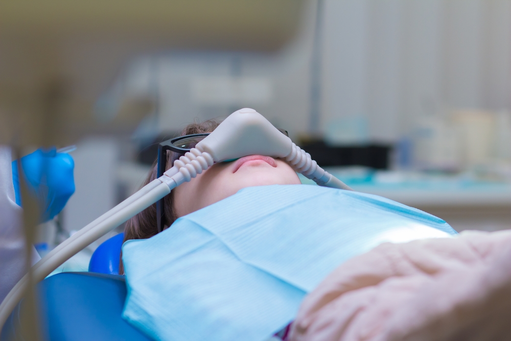 Dentistry.,Little,Girl,Getting,Inhalation,Sedation,While,Teeth,Treatment,At