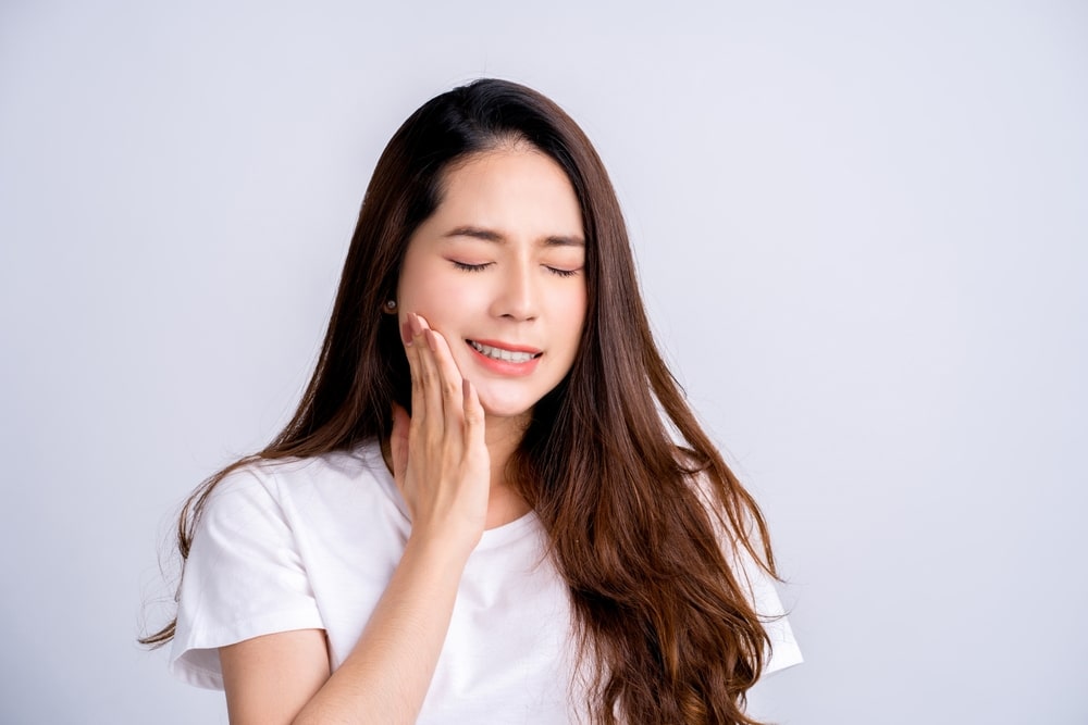 Beautiful,Asian,Woman,Has,A,Toothache,Isolated,On,White,Background.