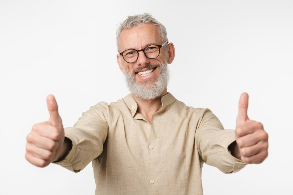 Happy,European,Mature,Middle-aged,Man,In,Beige,Shirt,And,Glasses
