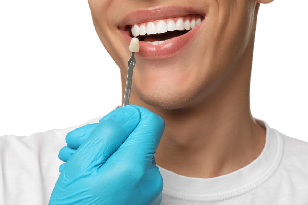 Doctor,Checking,Young,Man's,Teeth,Color,On,White,Background,,Closeup.