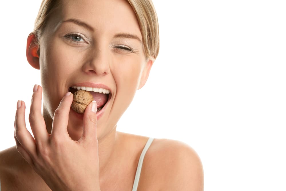 Woman,With,Walnut,Winking