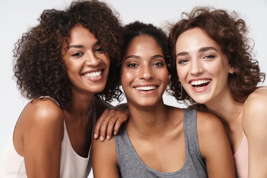Three Young Multiracial Women Smiling
