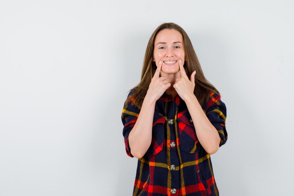 Patient Smiling After Tooth Extractions Treatment
